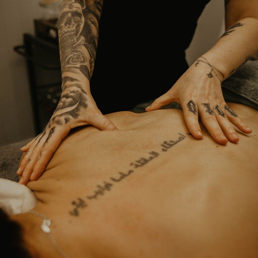 Amiee performing a deep tissue back massage